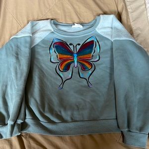 Girls sweatshirt velvet butterfly/shoulders. Runs small fits girls sz 10-12.